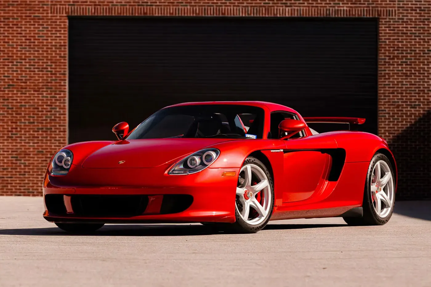 A Rare Porsche Carrera GT Finished in Ferrari’s ‘Rosso Fuoco’ Red Heads to Auction